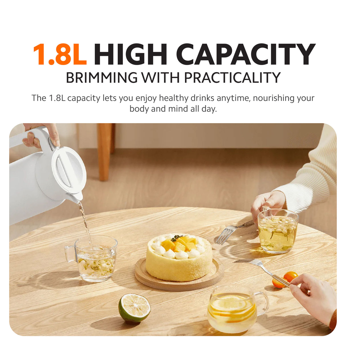 White insulated kettle pouring into glasses on a wooden table