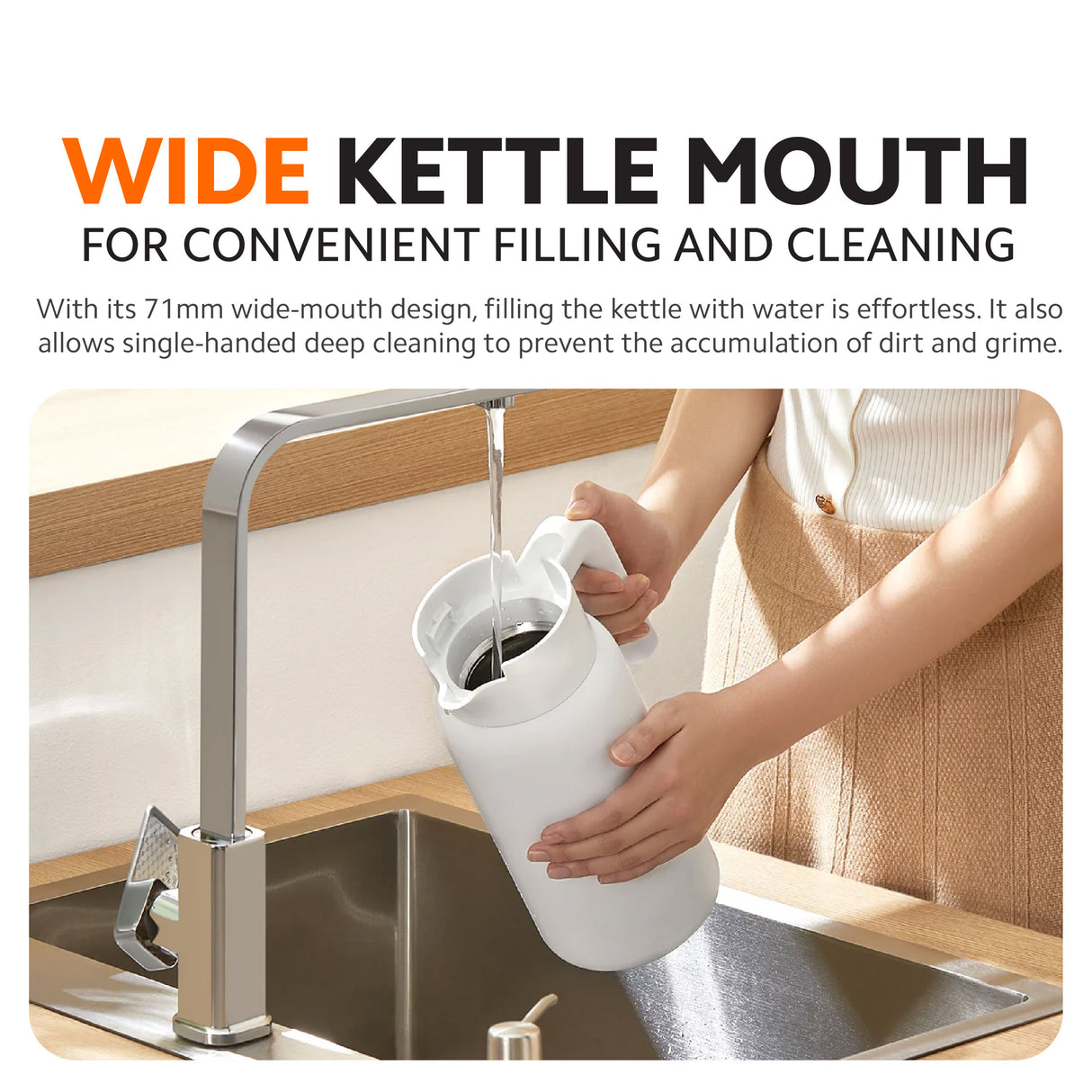 White insulated kettle with wide mouth pouring into a sink in the kitchen