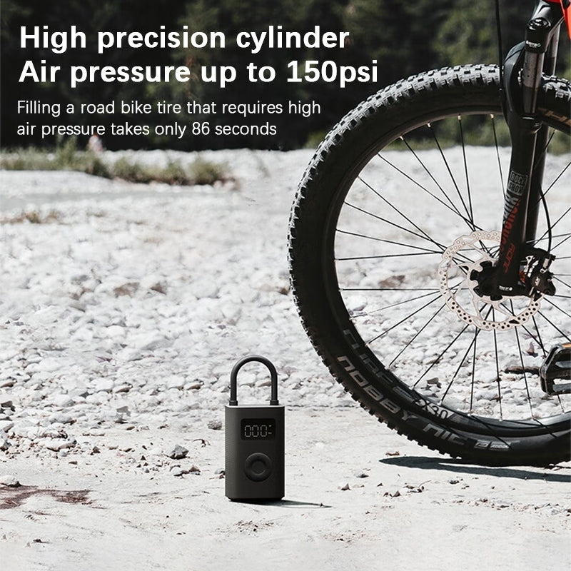 Portable air pump with LCD reading and attached nozzle hose for tire inflation