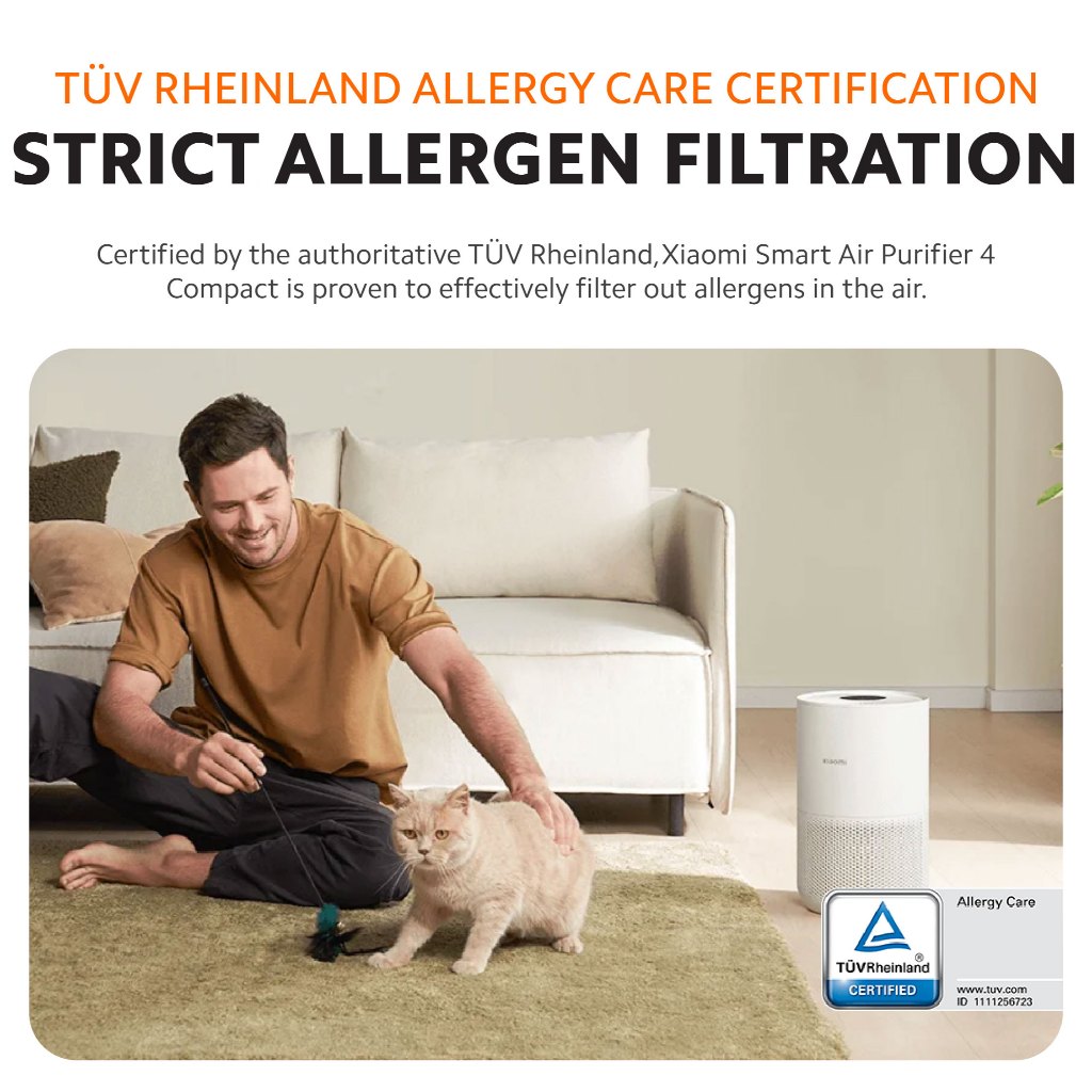White air purifier beside a sofa and cat, for strict allergen filtration.