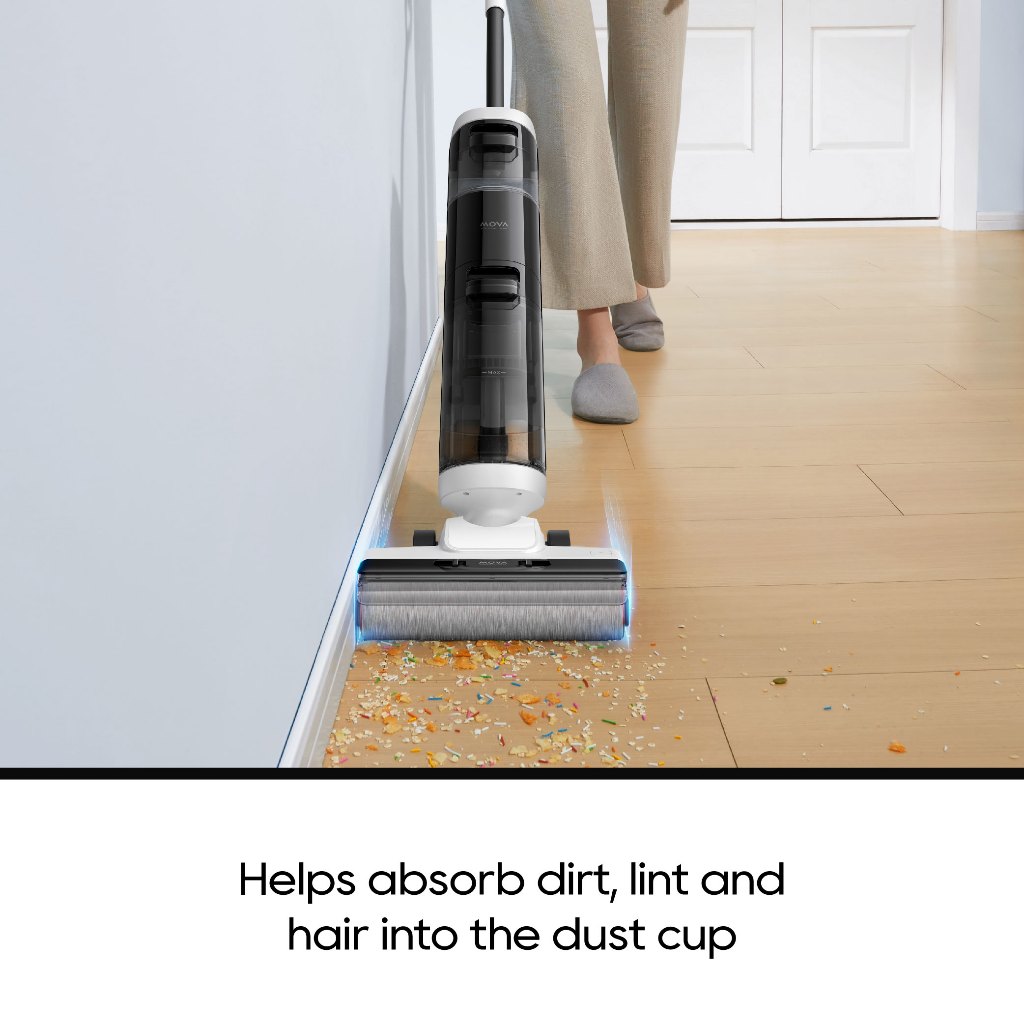 Upright vacuum cleaner with brush roller on floor, dust and debris visible