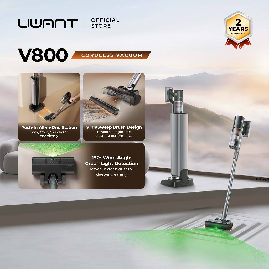 Cordless stick vacuum with stand and floor brush, silver and black.