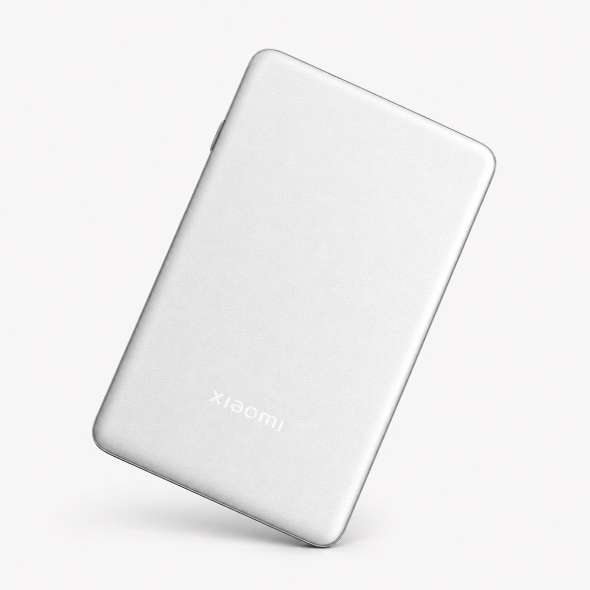 Portable photo printer Pro, white slim device with Xiaomi logo on the back.