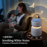 White air purifier with warm night light glow beside a nursing baby