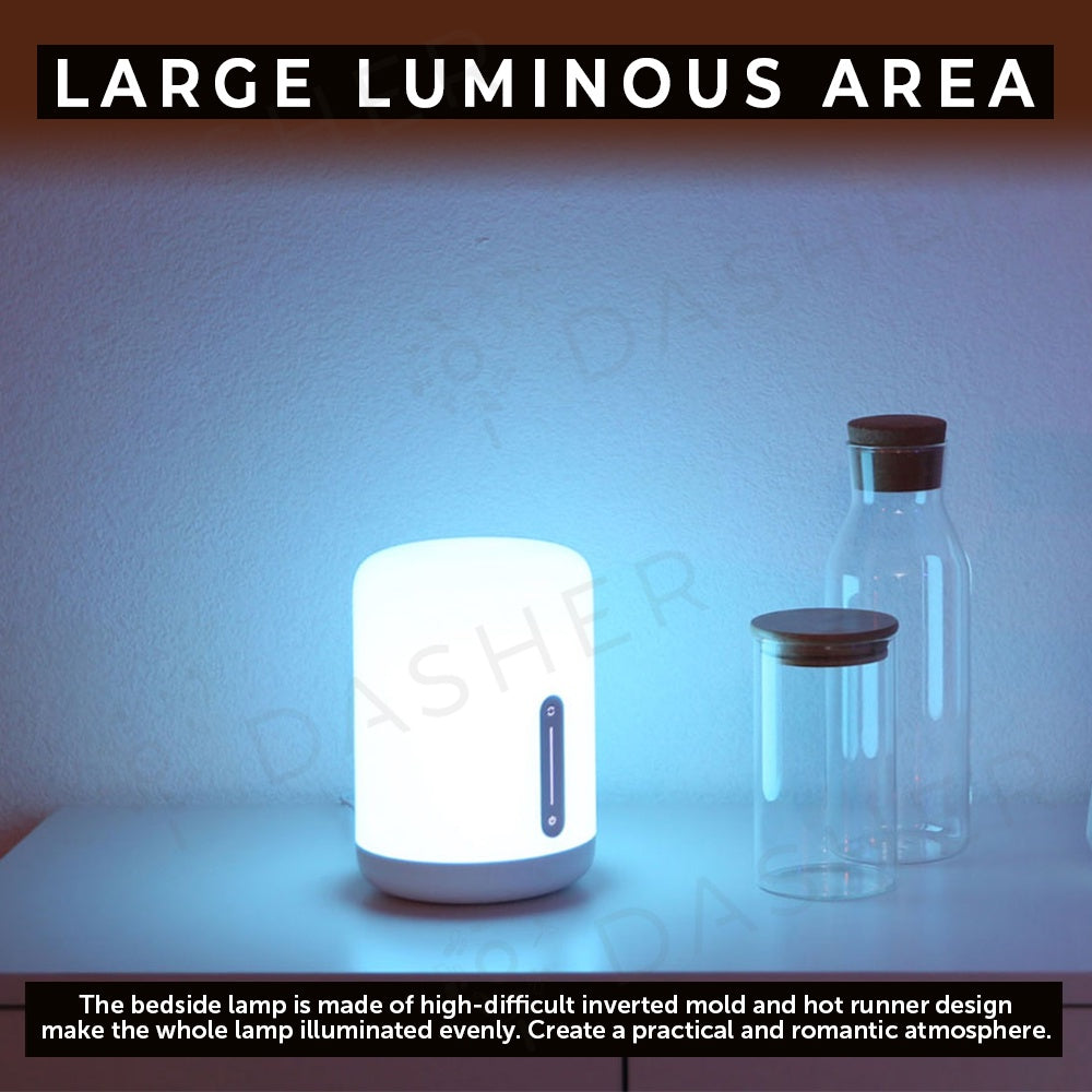 White bedside lamp with soft glow and vertical control strip