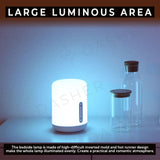 White bedside lamp with soft glow and vertical control strip