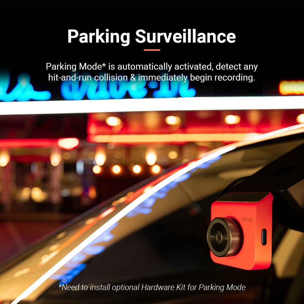 Red dash cam rear camera mounted inside a car near the windshield at night.
