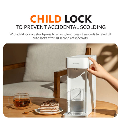 Instant hot water dispenser with hand reaching to unlock and dispense