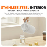 White insulated kettle pouring from open lid over a countertop