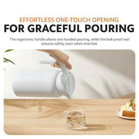 White insulated kettle pouring with round lid opened for one-touch opening