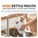 White insulated kettle with wide mouth pouring into a sink in the kitchen