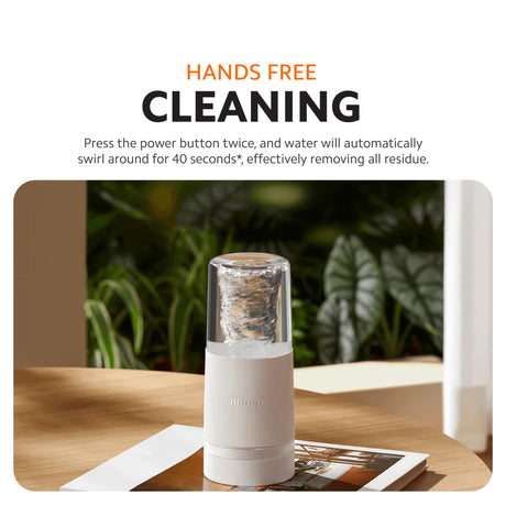 Xiaomi portable blender on countertop with water swirling inside cup