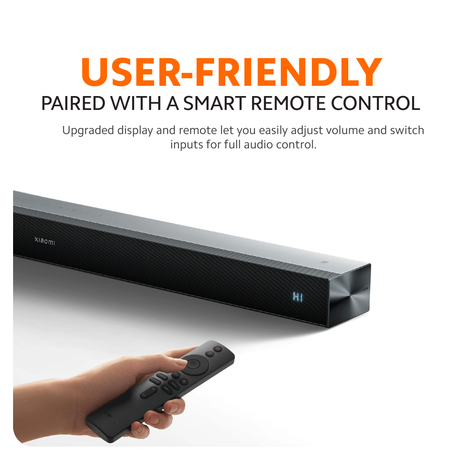 Soundbar with smart remote control in hand; sleek black speaker bar