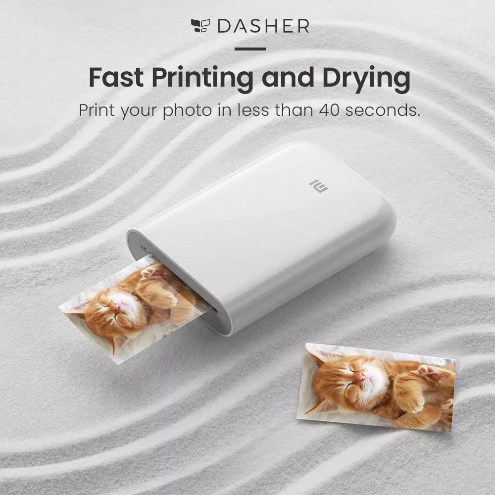 White pocket photo printer printing and drying small photo cards