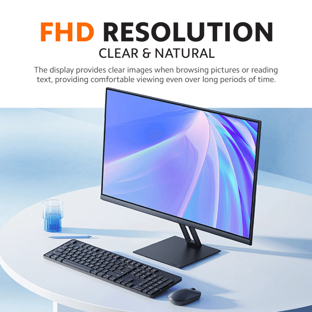Thin black desktop monitor angled view with keyboard and mouse on desk