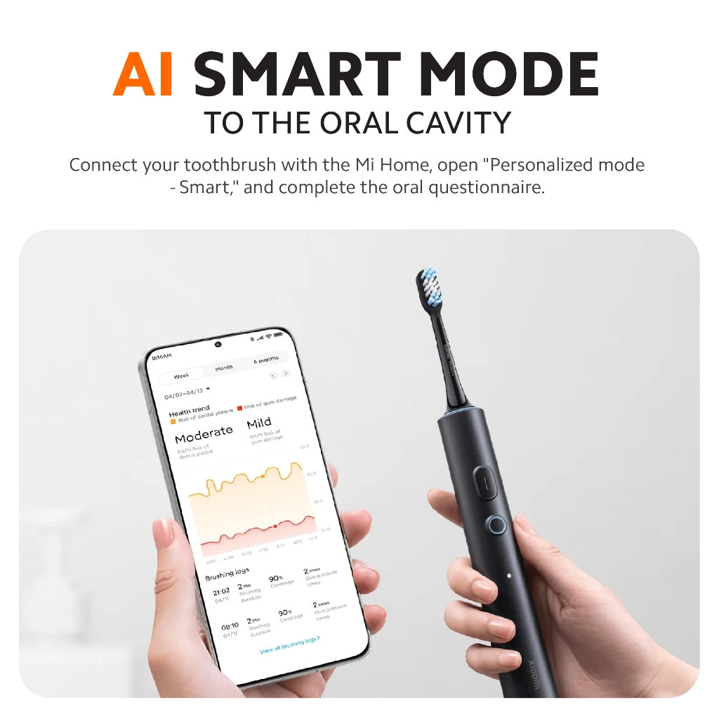 Dark grey smart electric toothbrush in hand, with smartphone app display