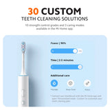White smart electric toothbrush with app-style settings graphic for cleaning time