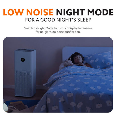 White compact air purifier on bedside table with top display lit.
