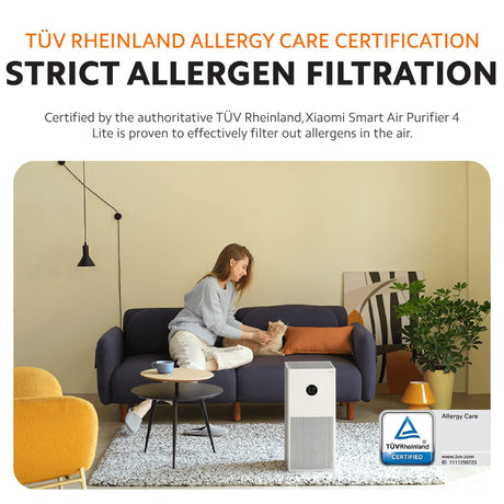 White air purifier unit with front grille, shown in a living room setting