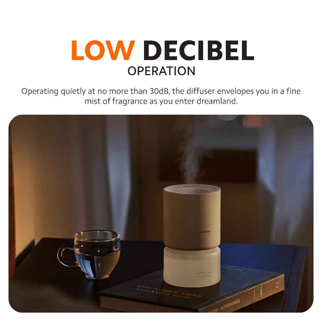 Xiaomi smart scent diffuser on tabletop with warm ambient lighting at night