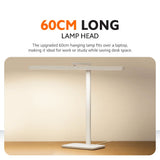White LED desk lamp with 60 cm long lamp head over a desk.