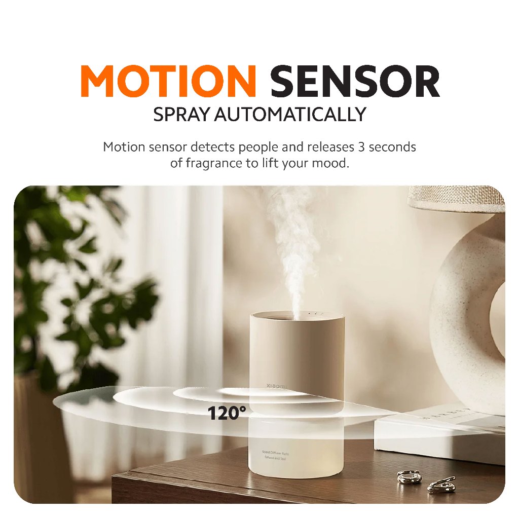 Xiaomi smart scent diffuser releasing a soft mist plume on a table