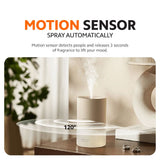 Xiaomi smart scent diffuser releasing a soft mist plume on a table