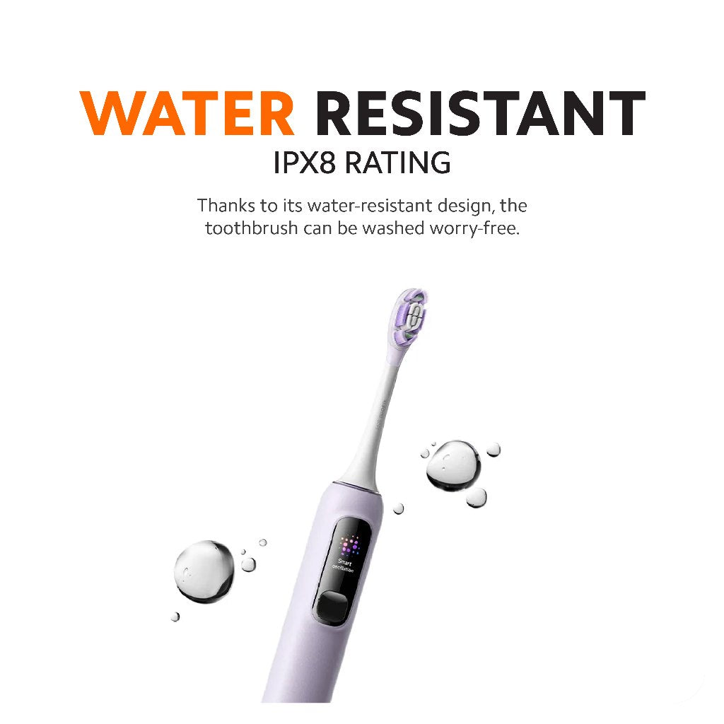 Water droplets on a purple electric toothbrush with black display window