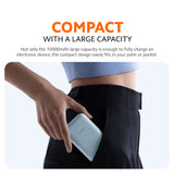 Ice blue power bank held in hand, slim compact body with integrated cable