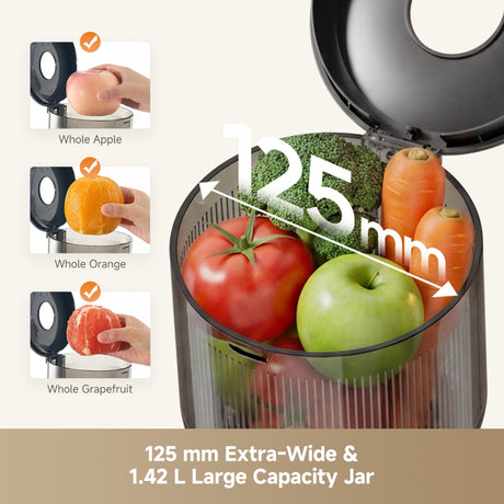 Black slow juicer with open feed chute, showing whole fruits in the jar