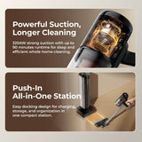 Cordless stick vacuum with clear dust canister and nozzle, silver and black.