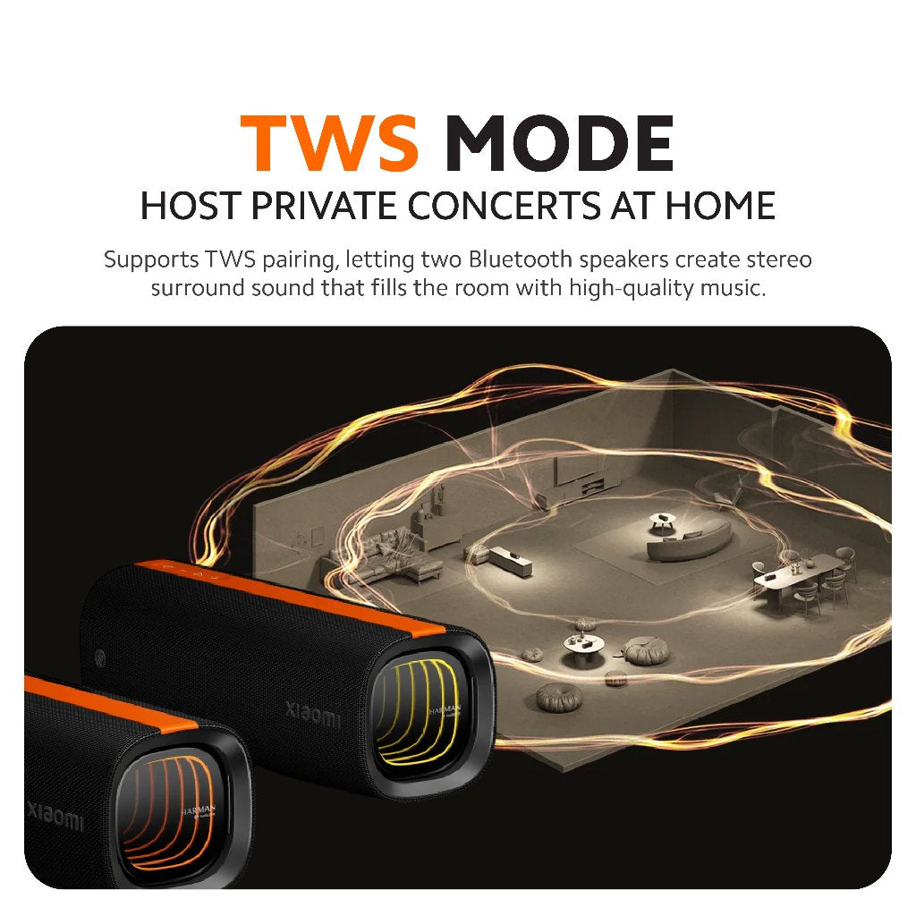 Black Bluetooth speaker with orange trim and glowing rings for TWS mode