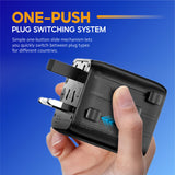 Universal one-push plug switch travel adapter in hand with sliding connector