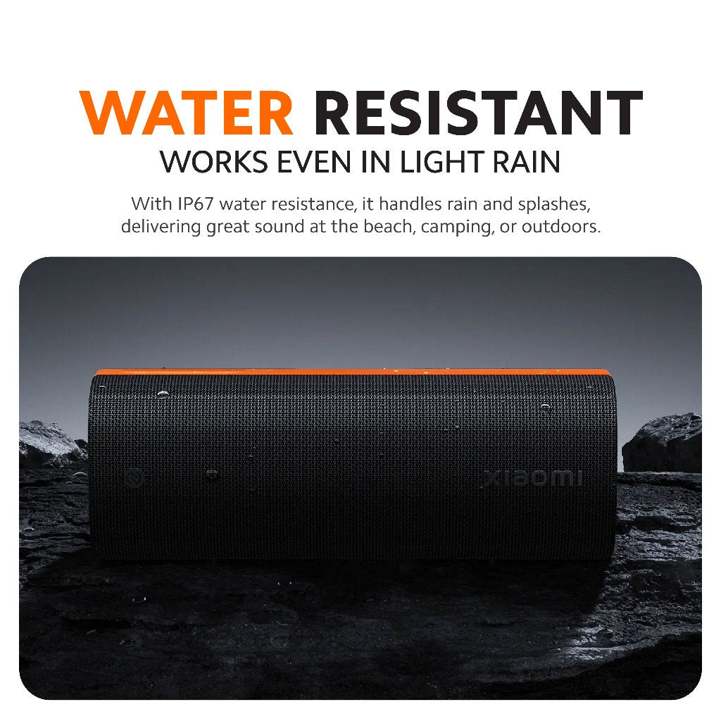 Black Bluetooth speaker with orange top stripe, water-resistant design
