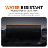 Black Bluetooth speaker with orange top stripe, water-resistant design