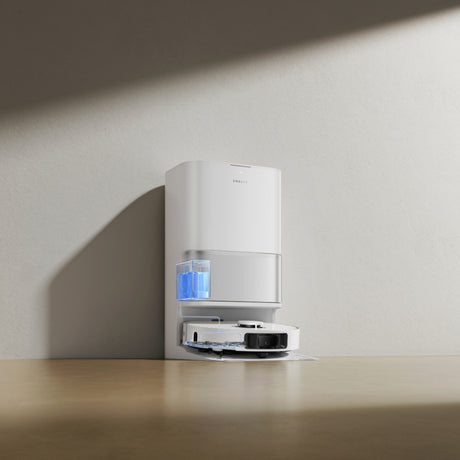 White auto detergent dispenser dock with blue cartridge and open base compartment