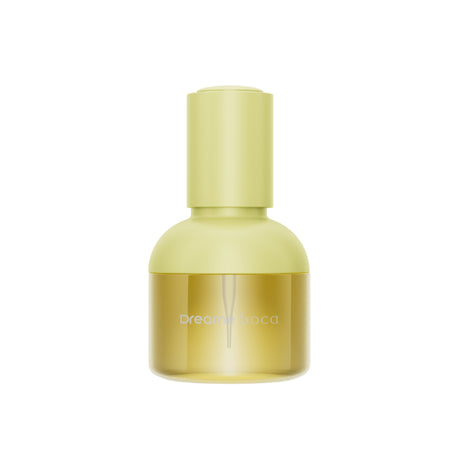 Dreame Boca 30 ml hair care essence bottle, pale yellow glass with matching cap.