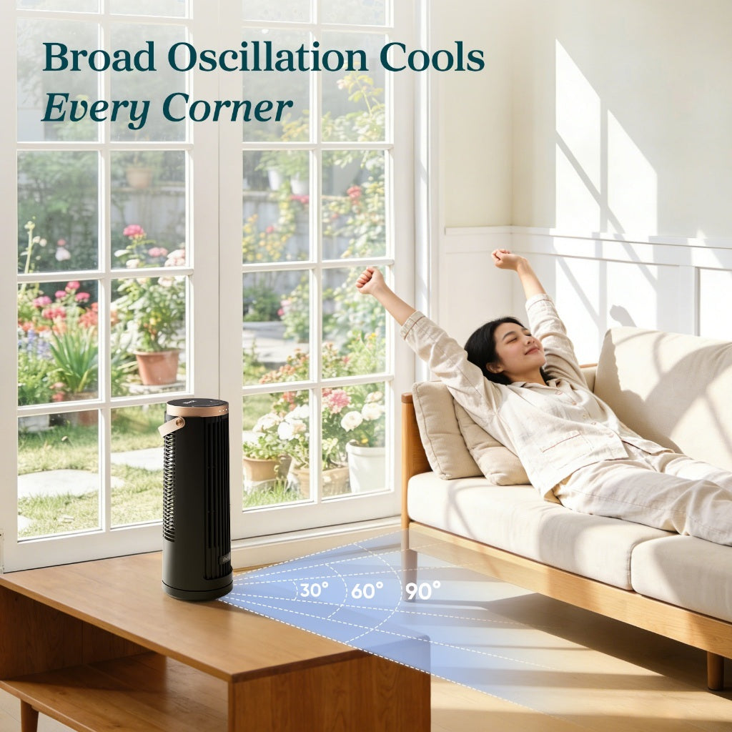 Black mini tower fan with vertical air vents on a wooden table