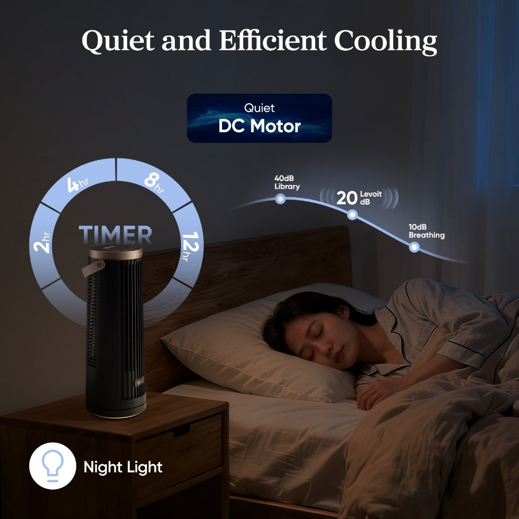 Black tower fan on a bedside table with visible top indicator lighting