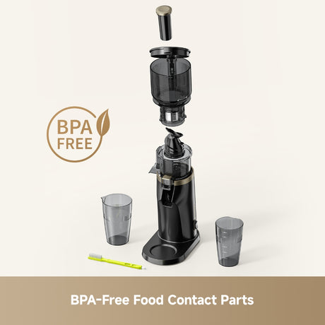 Black slow juicer with clear collection parts, two cups, and cleaning tool