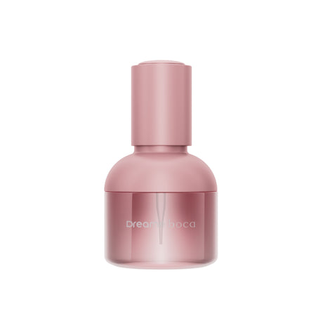 Dreame Boca 30 ml hair care essence bottle, pink glass with matching cap.