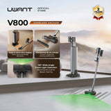 Cordless stick vacuum with stand and floor brush, silver and black.