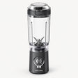 Portable blender with clear blending cup, black base, and twist-on lid