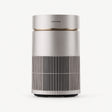 Desktop air purifier, white cylinder with dark vertical grille and top vent.