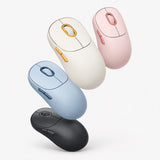 Wireless mouse in off-white, blue, pink, and dark grey, shown together