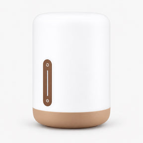 White bedside lamp with brown base and vertical power touch strip
