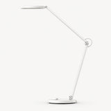 White LED desk lamp with long articulated arms and oval base, adjustable head
