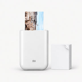 White pocket photo printer with photo sheet and stacked ZINK film