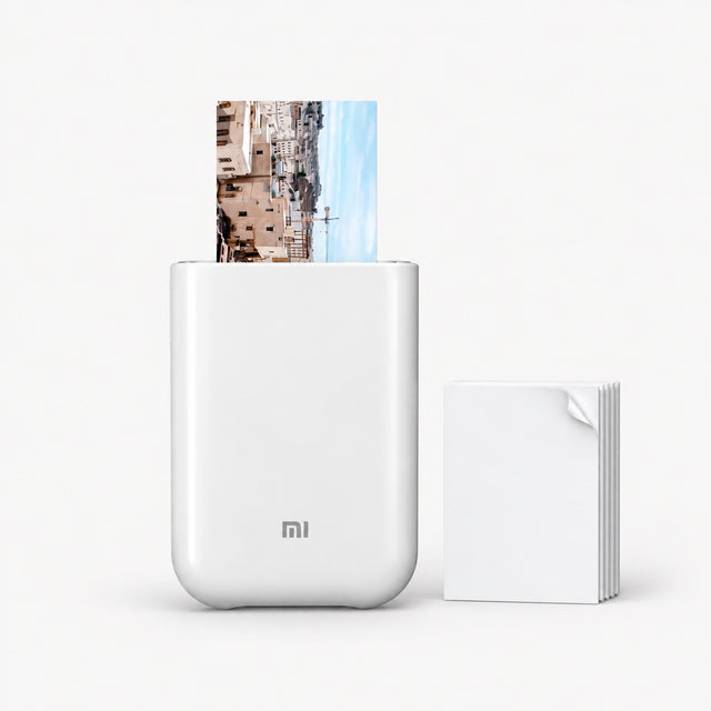 White pocket photo printer with photo sheet and stacked ZINK film