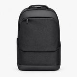 Black business backpack with top handle, front zip pocket, and padded back panel.